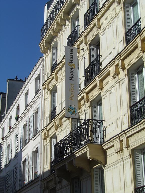 巴黎 完美旅舍旅舍 外观 照片 The photo shows a building with a light-colored facade and decorative architectural features. There's a sign hanging from the building that reads "Perfect Hotel/Hostel." The sign is prominently displayed, indicating that this is an accommodation esta